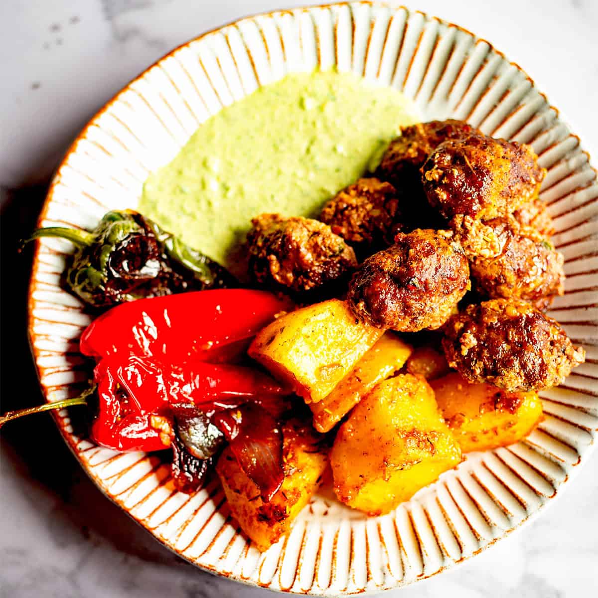 Turkish Köfte & Potato Traybake with Lemon Garlic Sauce Kofte with potatoes and sauce