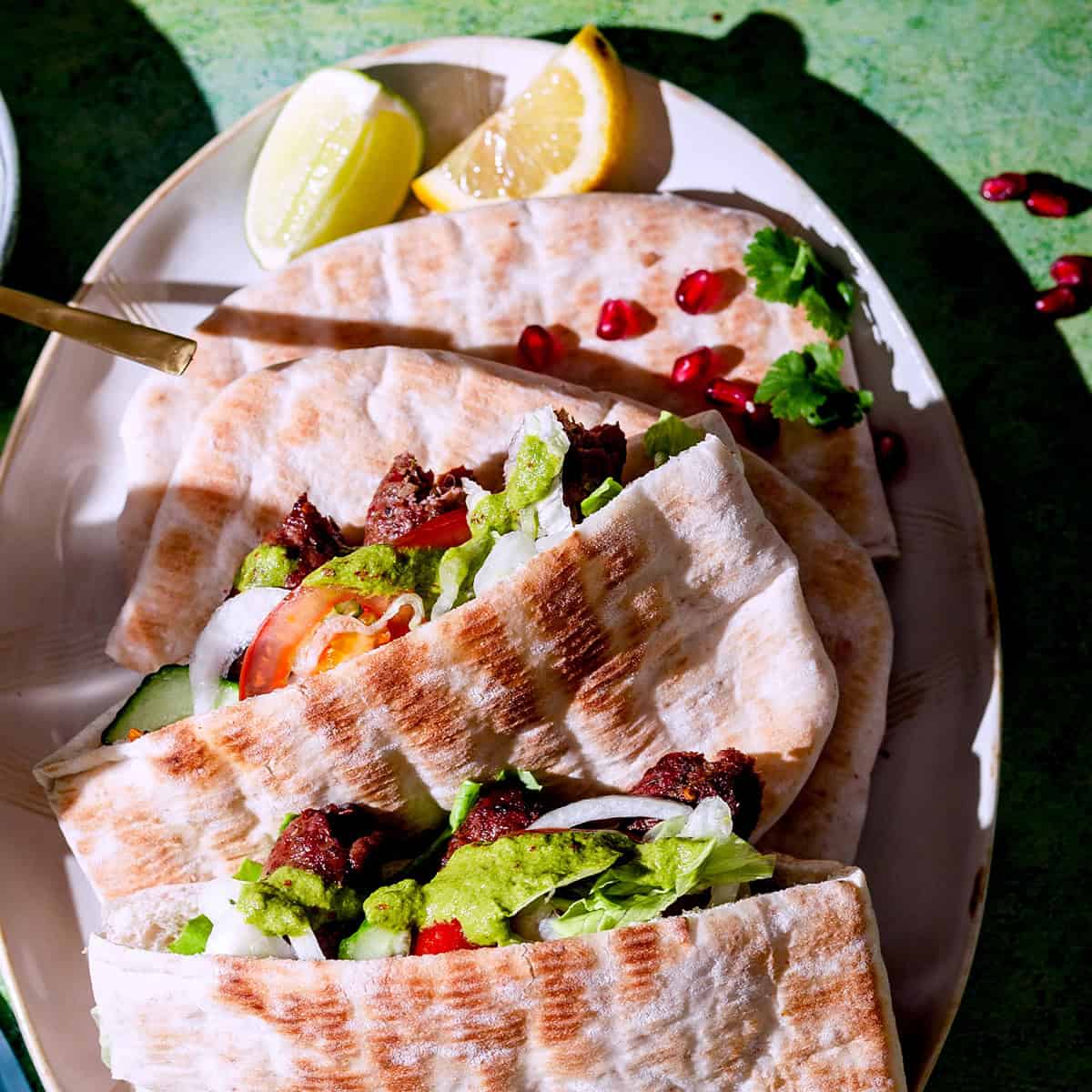 Turkish Köfte & Potato Traybake with Lemon Garlic Sauce Kofte in pitta bread