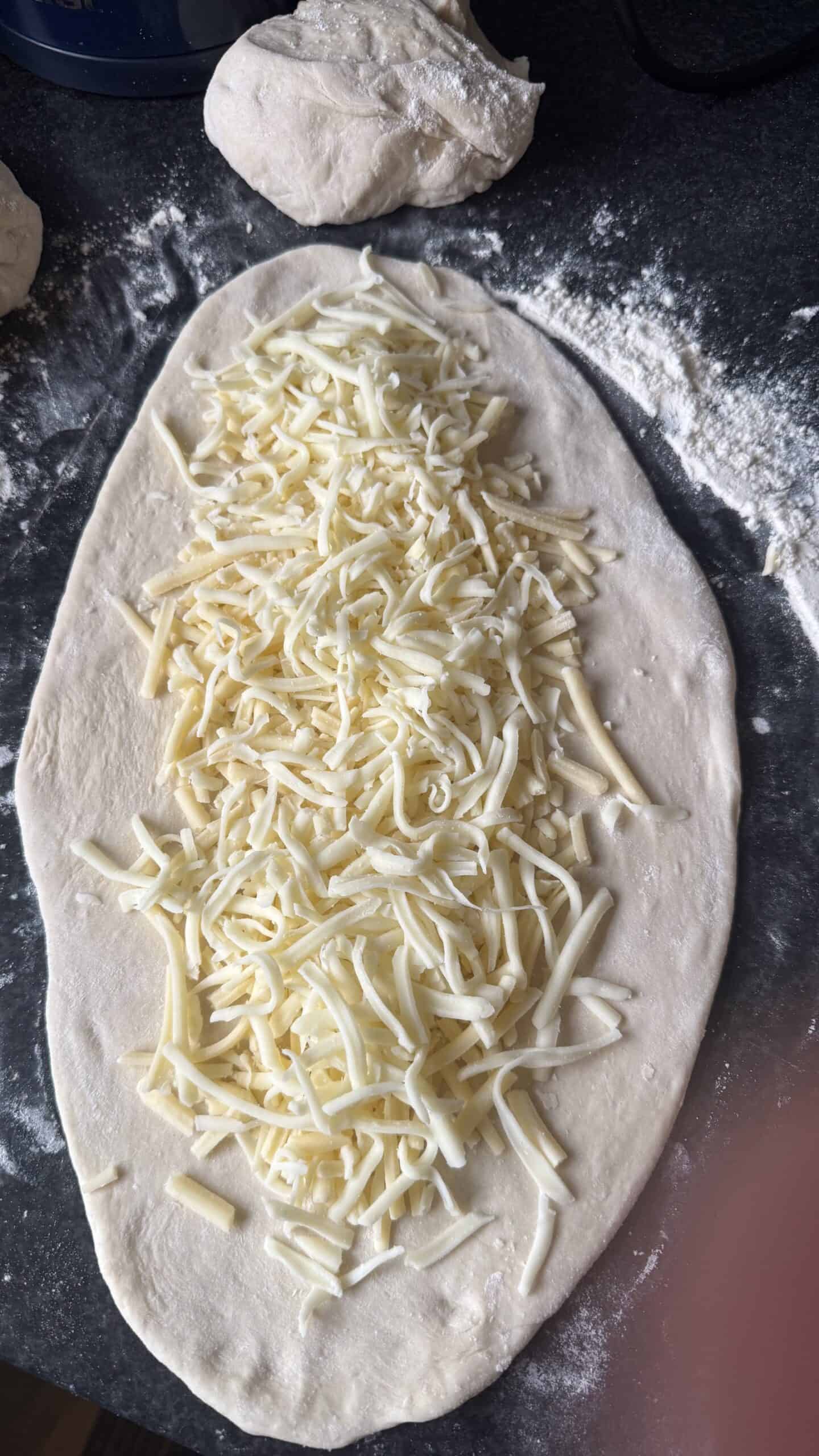 Khachapuri (Georgian Cheese Bread) Cheese on dough