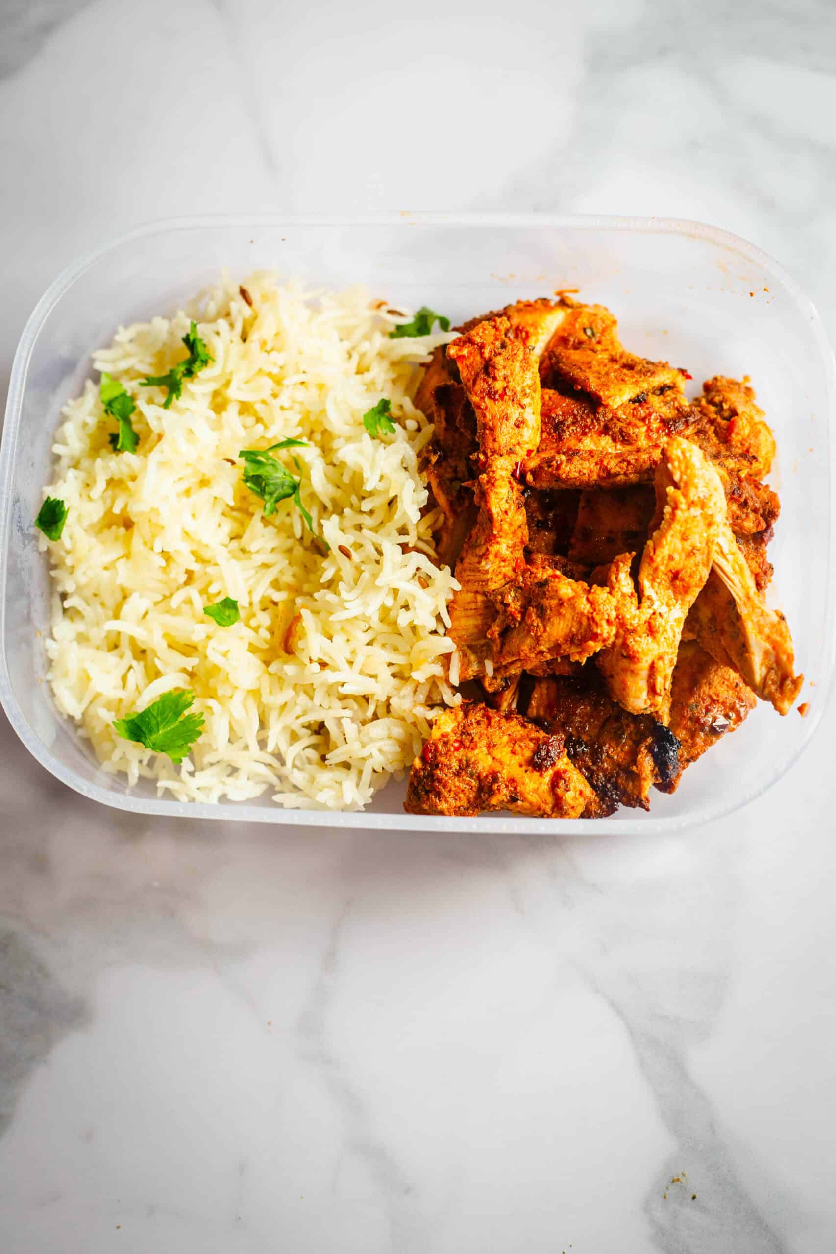 Harissa Chicken Thighs (Easy Oven-Baked Recipe) Harissa chicken thighs with cumin rice in box