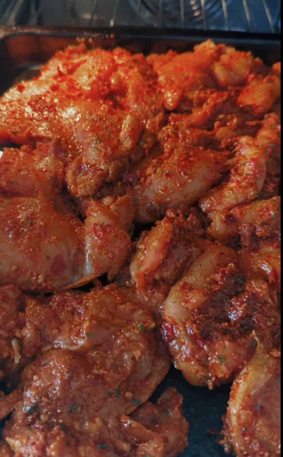 Harissa Chicken Thighs (Easy Oven-Baked Recipe) Harissa thighs going into oven