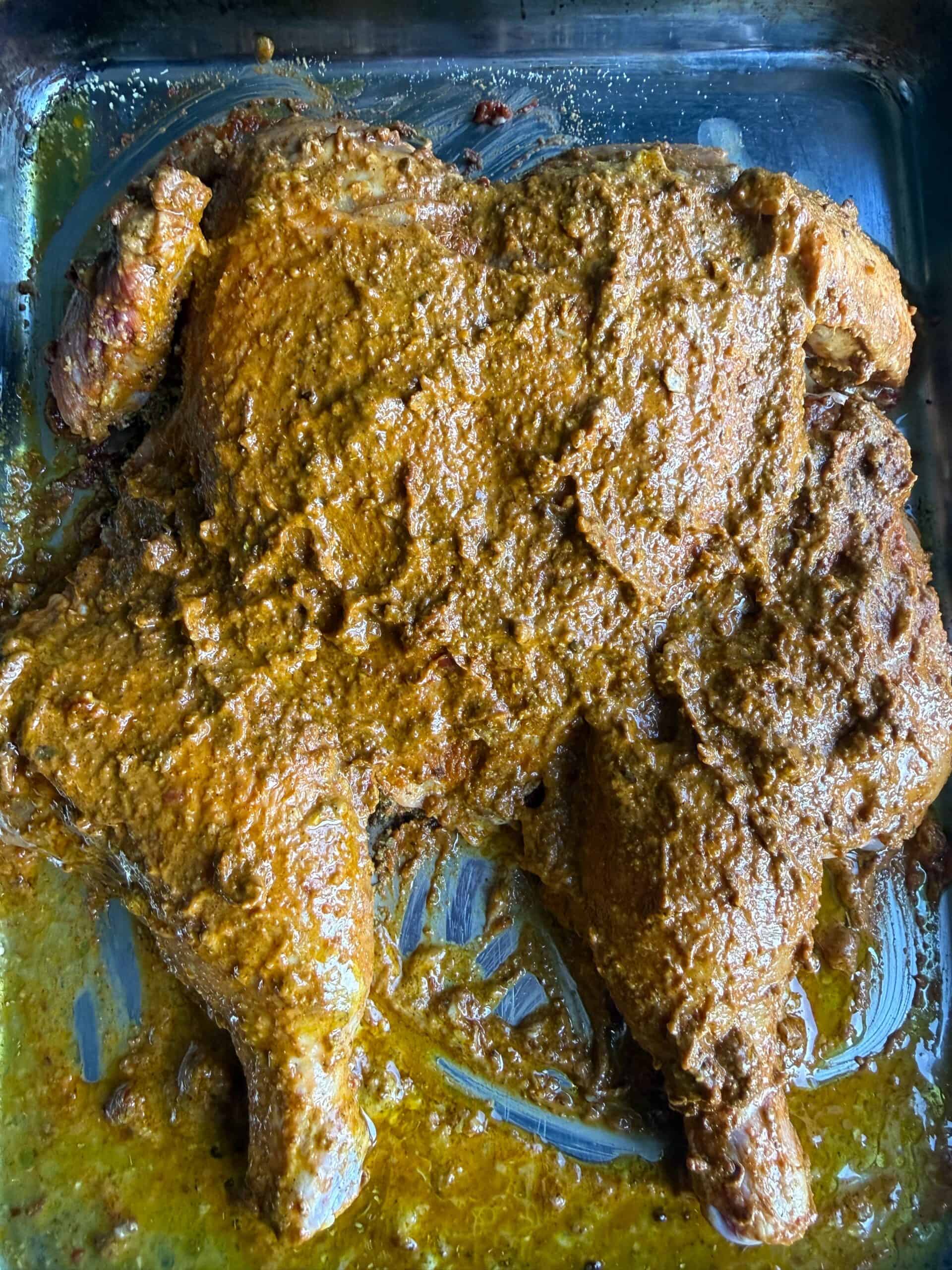Shawarma Spatchcock Roast Chicken (Easy Middle Eastern Roast Chicken) Marinaded Chicken in tin