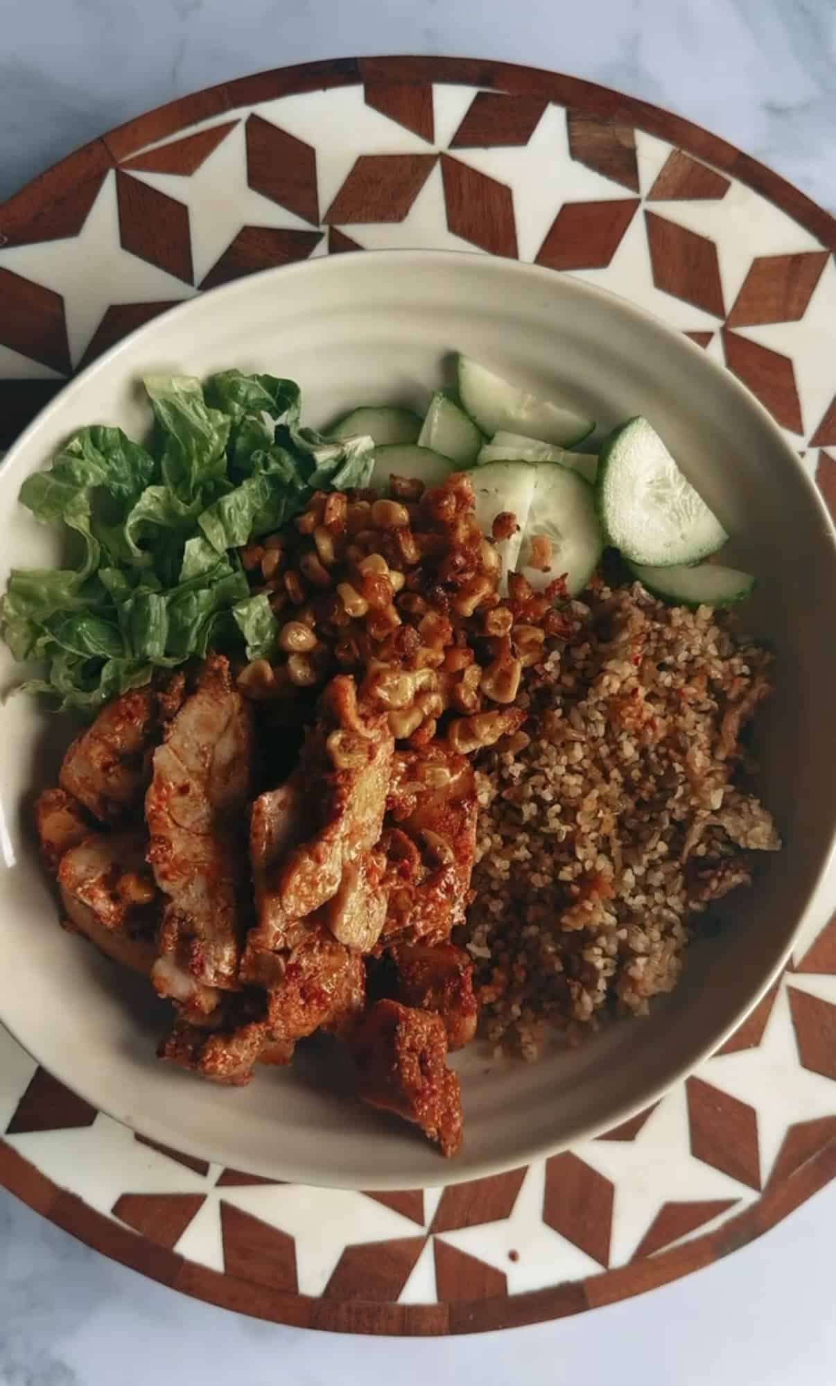 ATIS-Inspired Loaded Grain Bowl with Blackened Chicken Corn, Salad Grains and Chicken in bowl