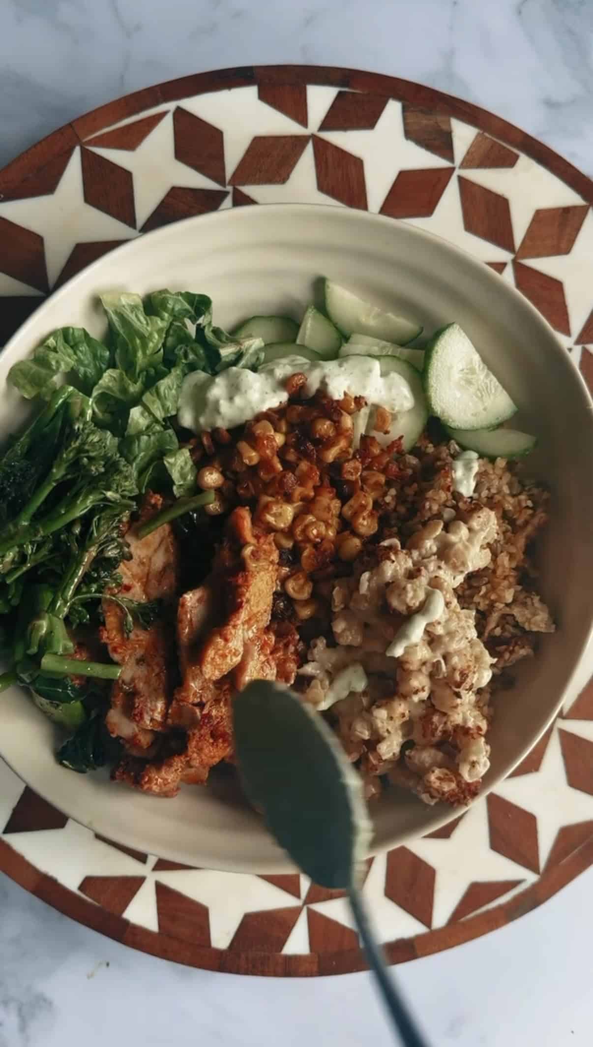 ATIS-Inspired Loaded Grain Bowl with Blackened Chicken Broccoli, Tahini Chickpeas added to bowl