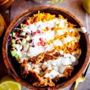 chicken Shawarma, rice, salad and garlic sauce in bowl