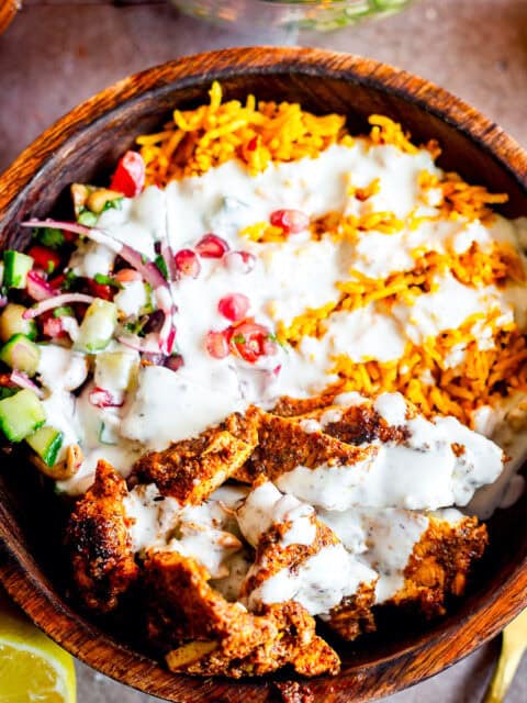 chicken Shawarma, rice, salad and garlic sauce in bowl