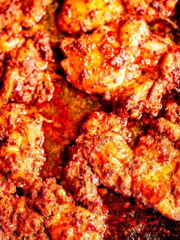 Harissa thighs in tray