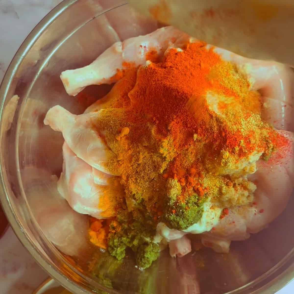 Dubai Iffa Chicken (Viral Creamy Chicken Recipe) Chicken and marinade ingredients in bowl