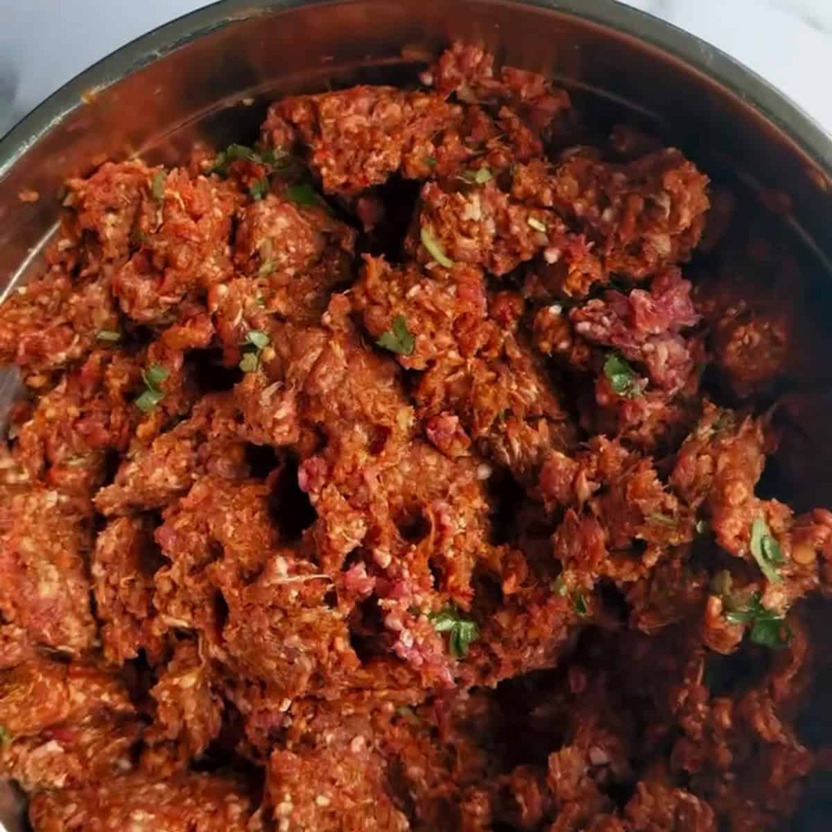 Middle Eastern Smash Tacos (Lebanese-Inspired) Mixed lamb in bowl