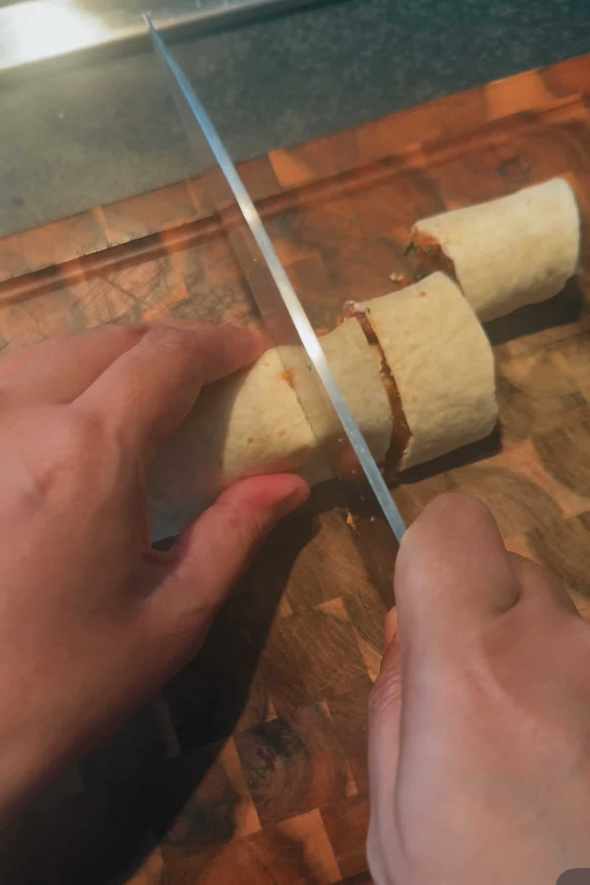 Viral Pinwheel Kebab Wraps Wrap being cut into pinwheels