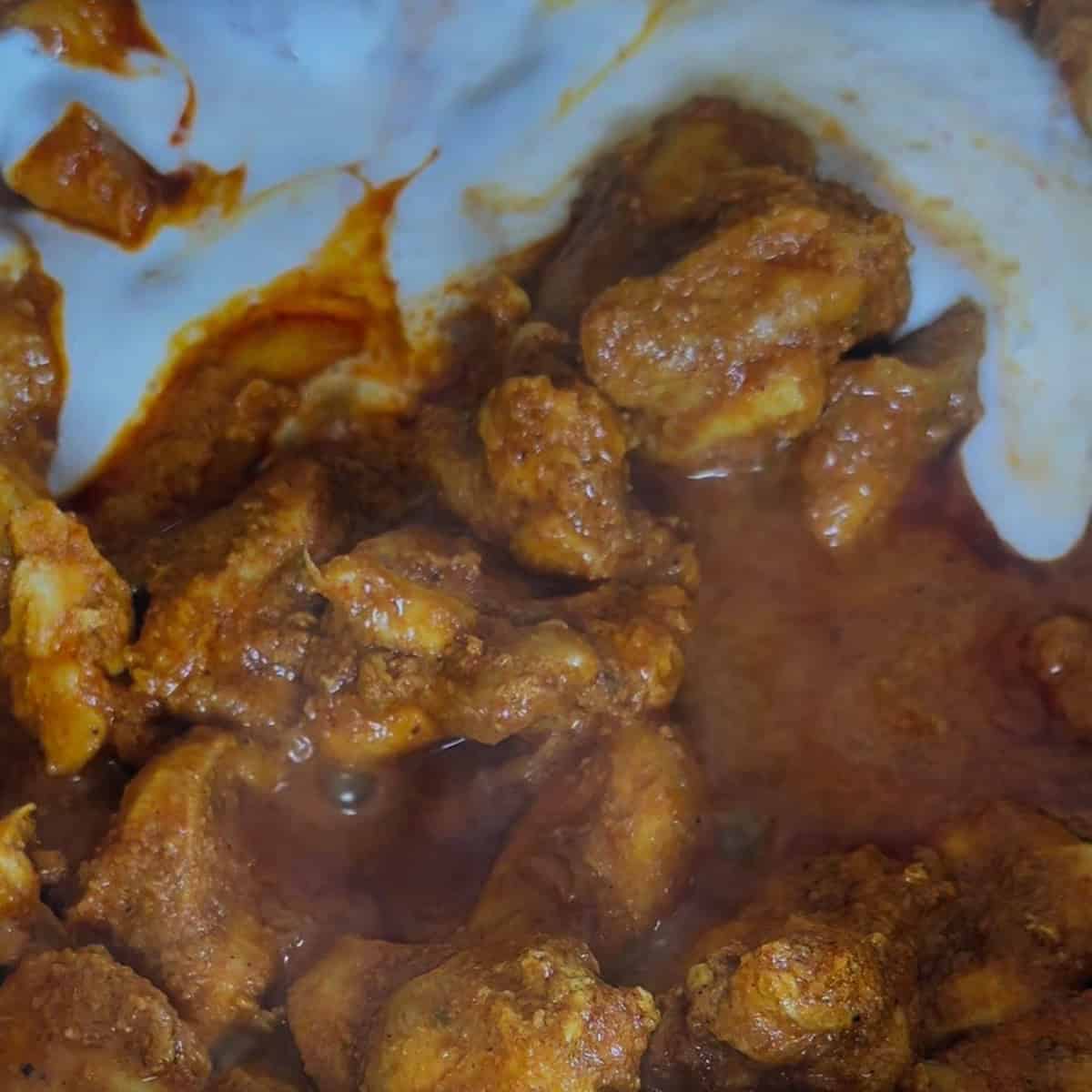 Dubai Iffa Chicken Curry (Boneless Chicken Version) Sauce poured over chicken in pan