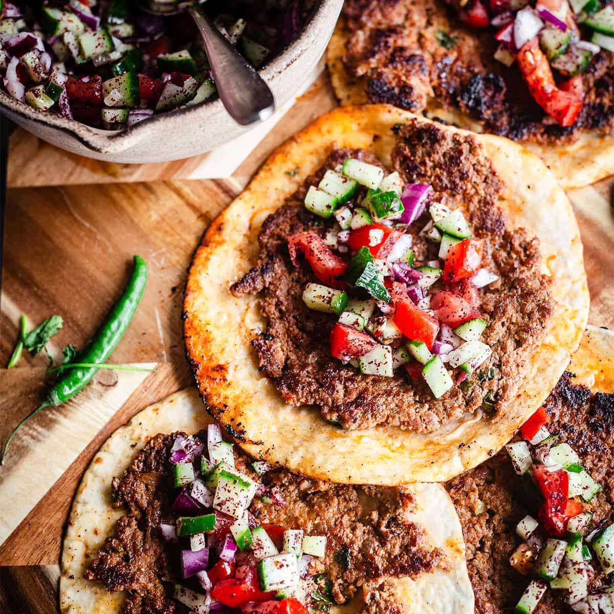 Middle Eastern Smash Tacos (Lebanese-Inspired) Smash tacos with salad on board