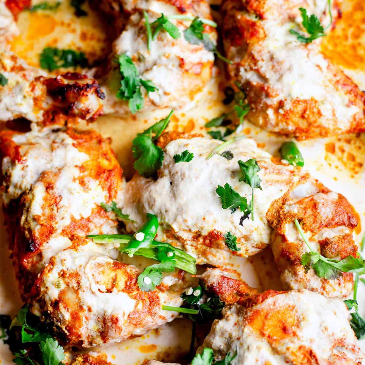 Dubai Iffa Chicken (Viral Creamy Chicken Recipe) iffa chicken with sauce in tray
