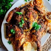 Mandi chicken on rice on platter