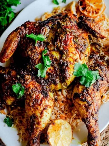 Mandi chicken on rice on platter