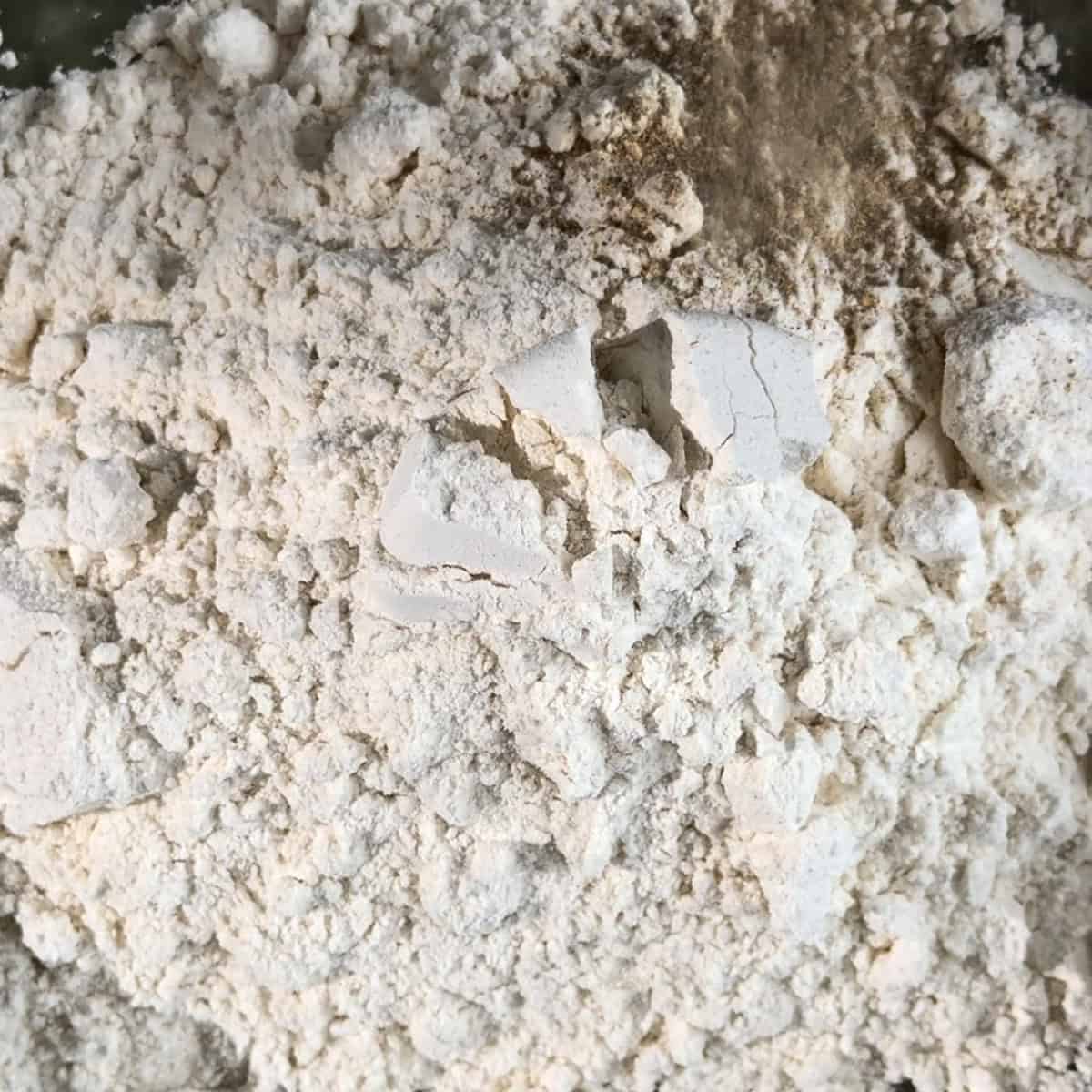 Flour, salt and cardamom added to bowl