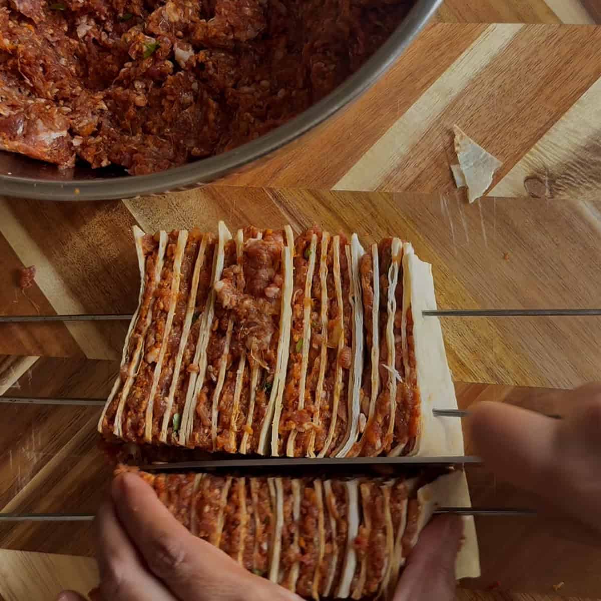 Skewered tortillas being cut into rectangles