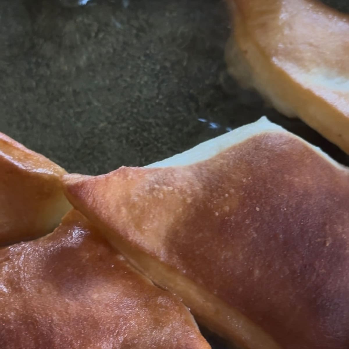 Mandazi being fried
