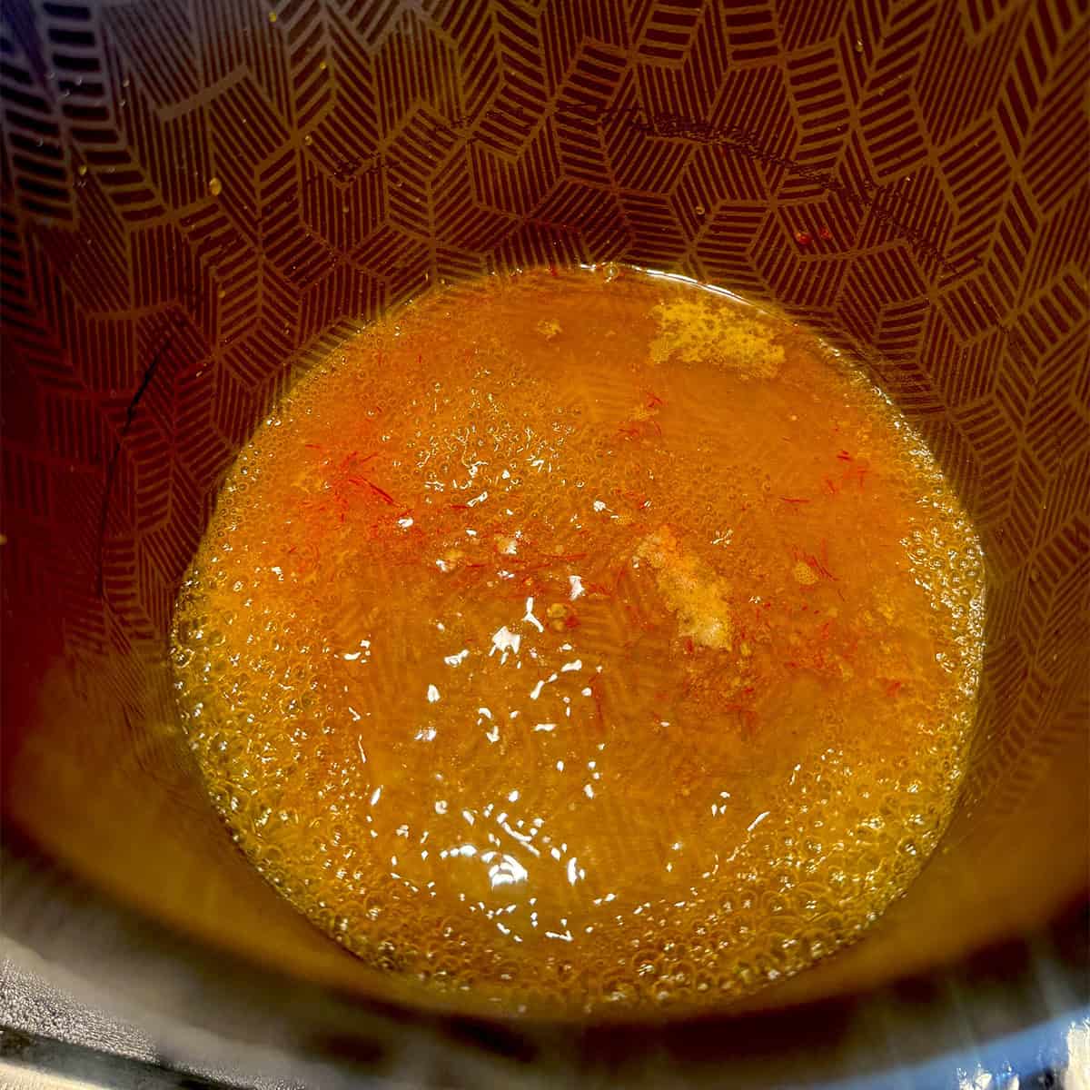 Saffron, sugar and some water in tea pot