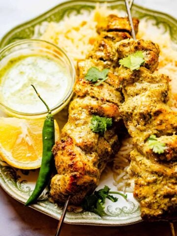Hariyali Chicken Skewers in plate with Chips