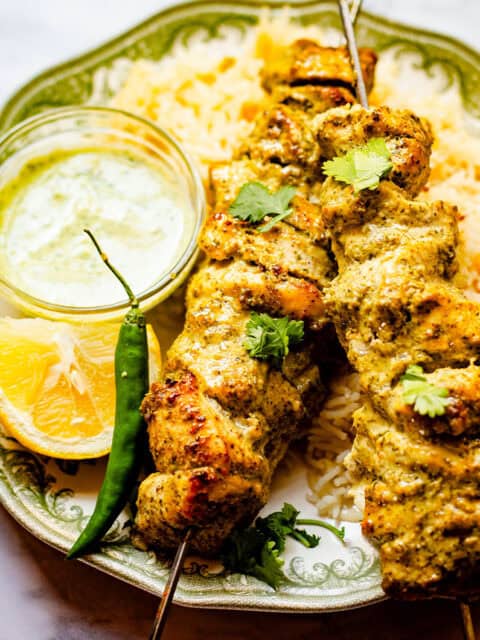 Hariyali Chicken Skewers in plate with Chips