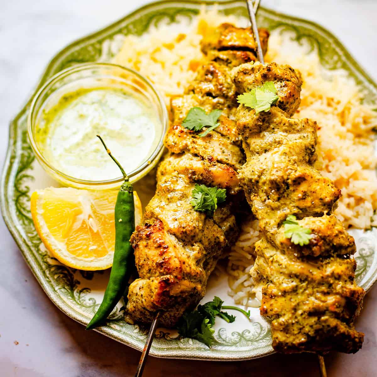 Hariyali Chicken Skewers in plate with Chips