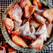 Mandazi in dish with icing sugar on top