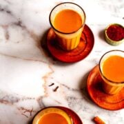 3 cups saffron chai on table