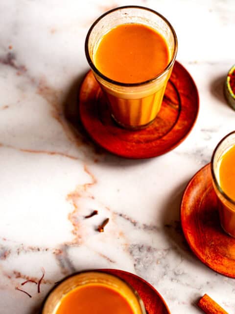 3 cups saffron chai on table
