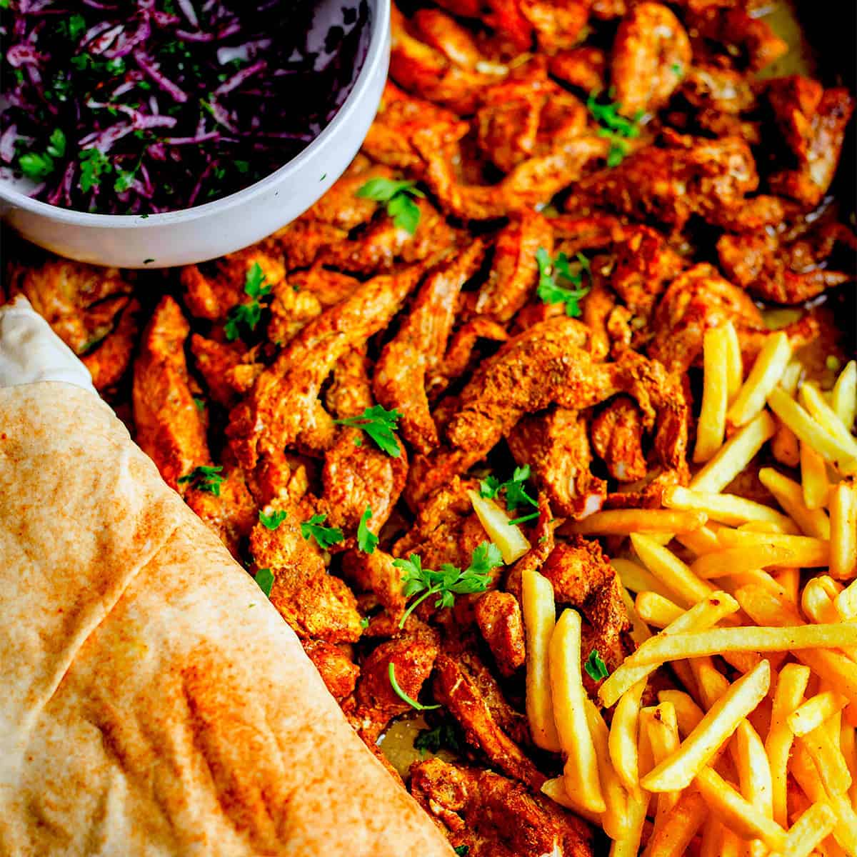 Shawarma in tin, with chips and salad
