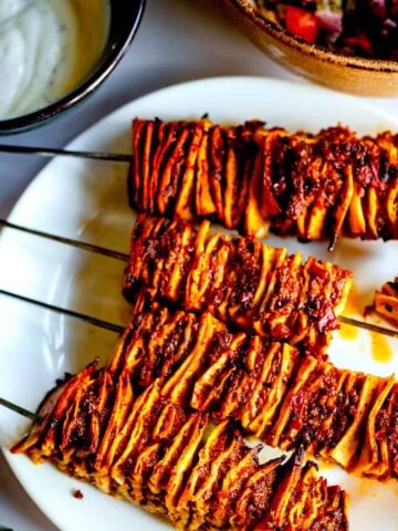 Tortilla kebab skewers on plate