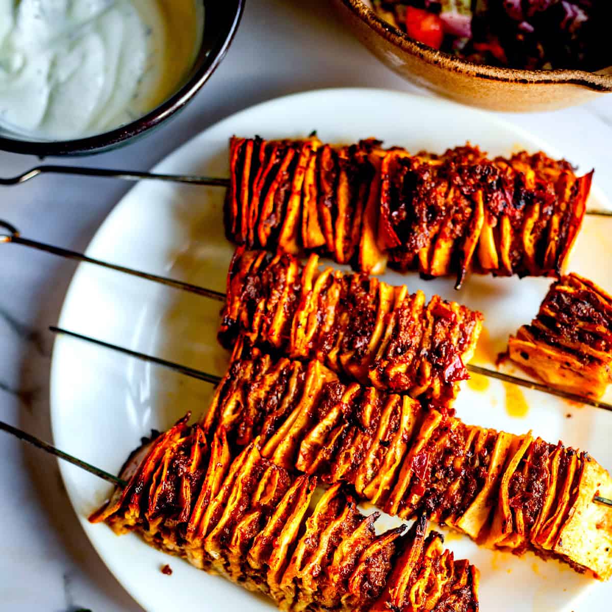 Tortilla kebab skewers on plate